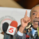 Michael Brown Sr. (left) listens as the Rev. Al Sharpton speaks to the media during a press conference at Greater St. Mark Church in Dellwood, Mo., Nov. 25, 2014.
Michael B. Thomas/AFP/Getty Images